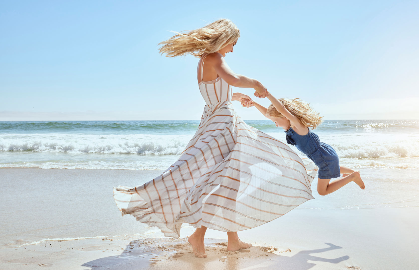 Mother and daughter on the beach